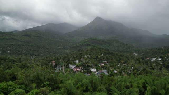 Misty Mountains of Kerala: Lush Green Peaks and Valley Villages