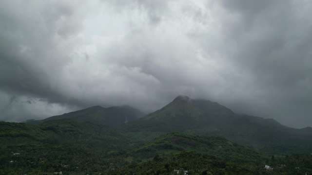 Misty Mountain Peaks Shrouded in Dense Clouds