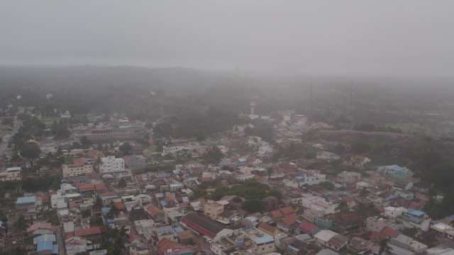 Aerial View of Small Town Covered in Thick Fog