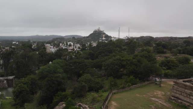 Scenic Hilltop Cityscape with Temple and Verdant Landscape