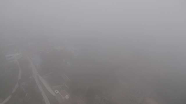 Aerial View of Cheluvanarayana Swamy Temple in Dense Mist