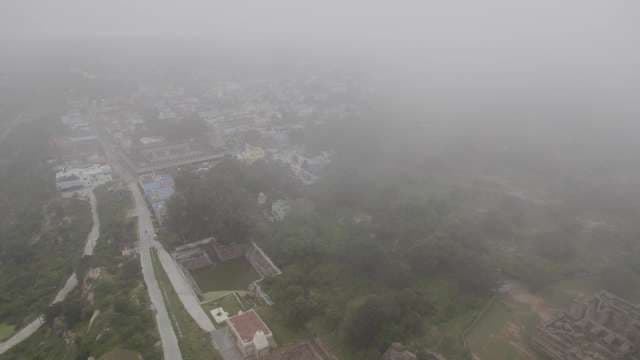 Aerial View of Foggy Town Landscape with Buildings