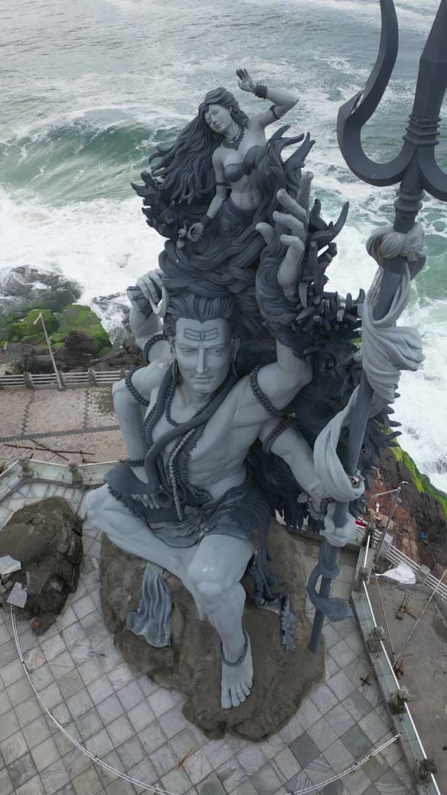 Divine Shiva and Parvati Coastal Statue Overlooking Ocean Waves