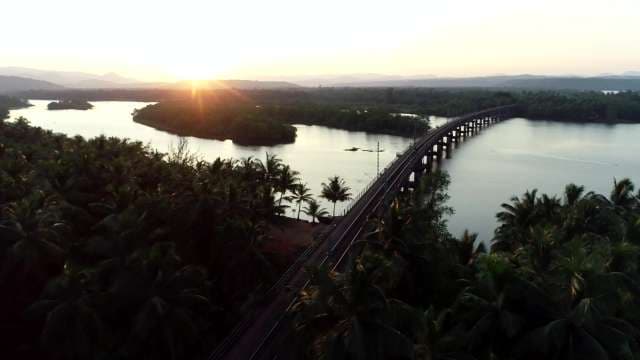 Aerial Bridge Over Tropical River at Sunrise
