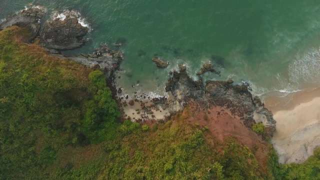 Rocky Cliffs Meet Emerald Waters