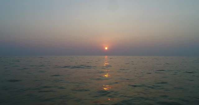 Golden Sunset Over Calm Ocean Waters