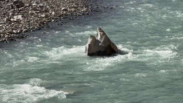 Scenic Rock Formation in Turquoise River Waters