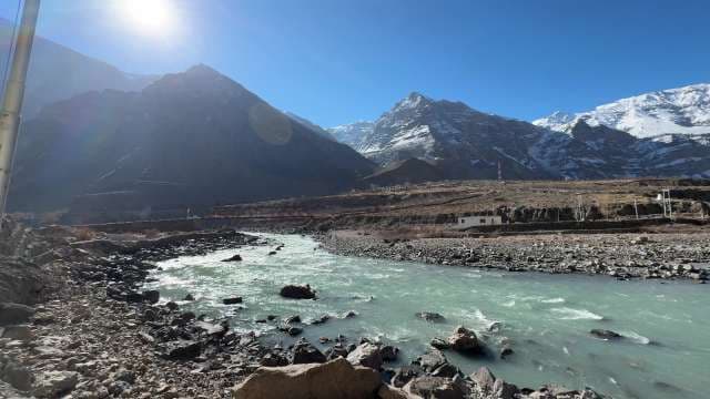 Turquoise River Flowing Through Himalayan Mountain Valley