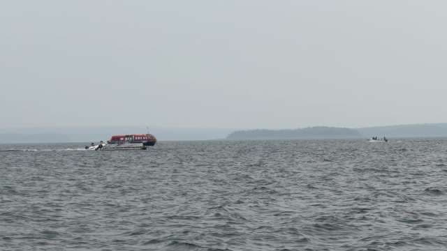 Red High-Speed Ferry Operating on Open Waters