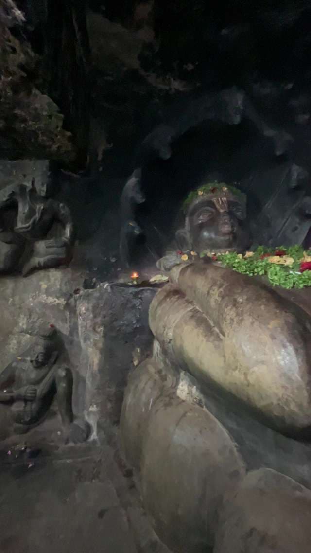 1600-year-old reclining statue of Lord Vishnu at the Undavalli Caves in Vijayawada