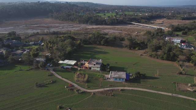 Aerial View of Rural Valley Farm and River Landscape