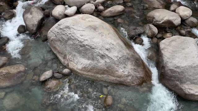 Mountain Stream with Boulders and Flowing Water