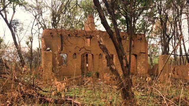 Abandoned Brick Fort Ruins Surrounded by Dense Forest