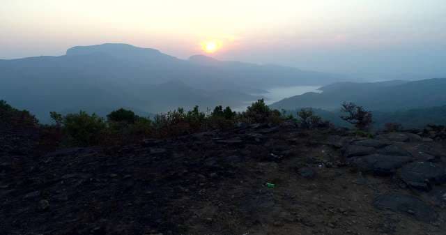 Majestic Mountain Sunrise Over Misty Valley Lake