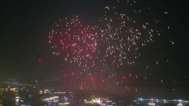 Spectacular Red and Gold Fireworks Over Night City