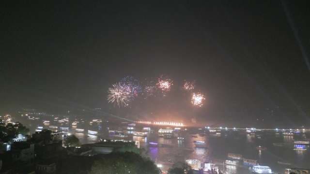 Spectacular Fireworks Display Over Illuminated River City