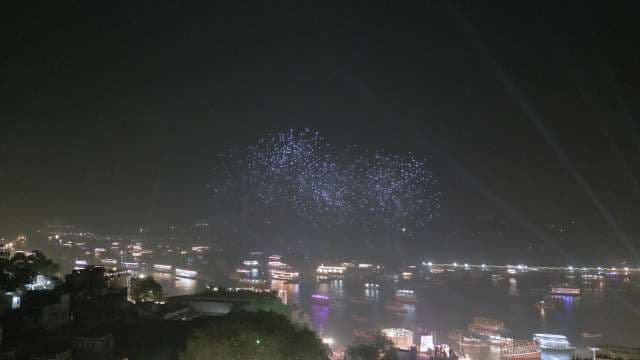 Spectacular Drone Light Show Over Riverside City Night