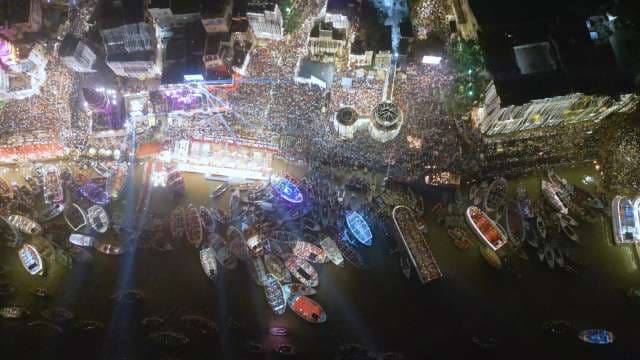 Vibrant Night Aerial View of Crowded Harbor Festival
