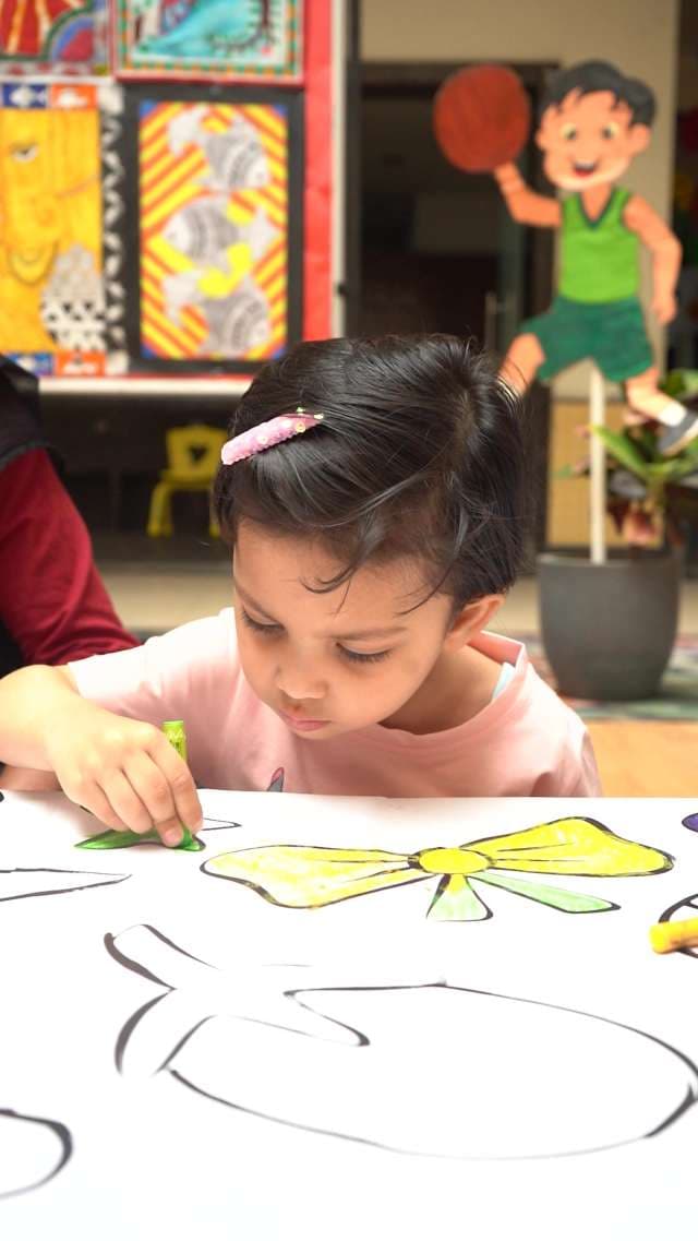 Young Girl Child Engaged in Creative Coloring Activity