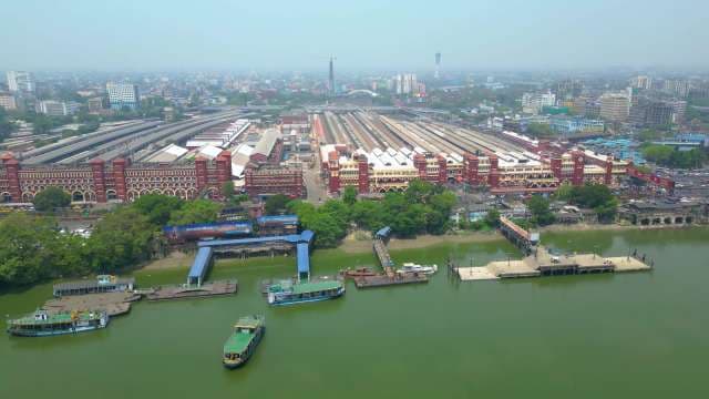 Kolkata's Historic Railway Station and Riverfront Cityscape