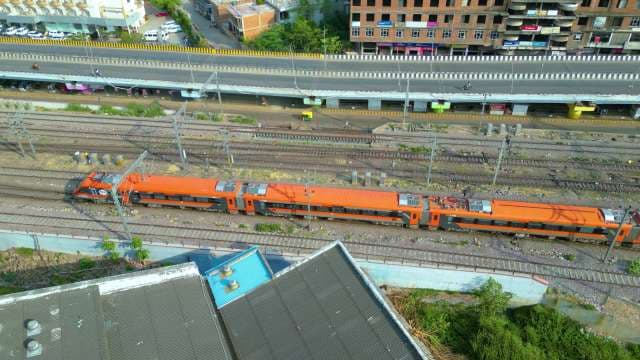 Aerial View of the Vibrant Orange Amrit Bharat Express in India