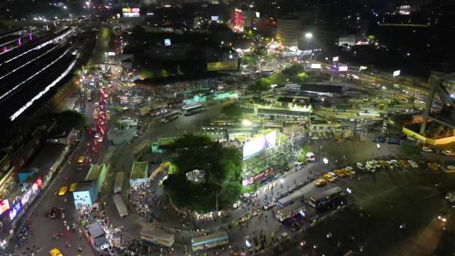 Vibrant Night Cityscape and Busy Bus Terminal at Howrah Station Kolkata