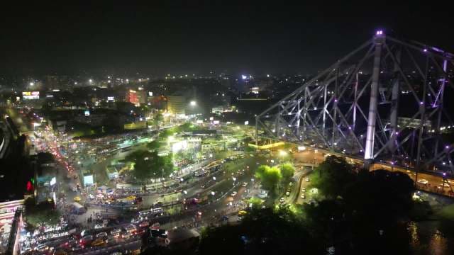 Iconic Howrah Bridge Illuminated at Night in Kolkata, India