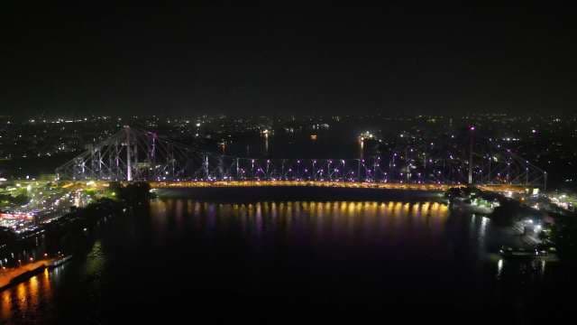 Majestic Howrah Bridge Night View with Stunning City Light Reflections