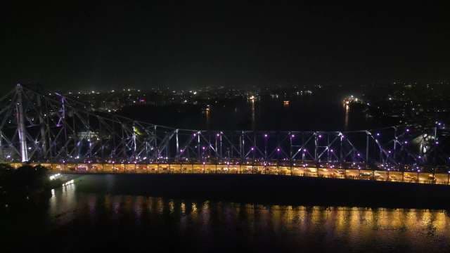 Stunning Night View of Howrah Bridge Illuminated Over Hooghly River
