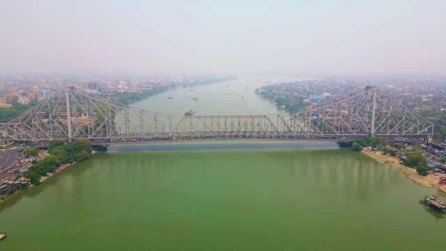 Majestic Aerial View of Howrah Bridge Over Hooghly River in Kolkata