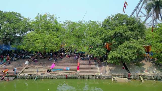 Vibrant Daily Life at the Ghats Near Howrah Bridge in Kolkata