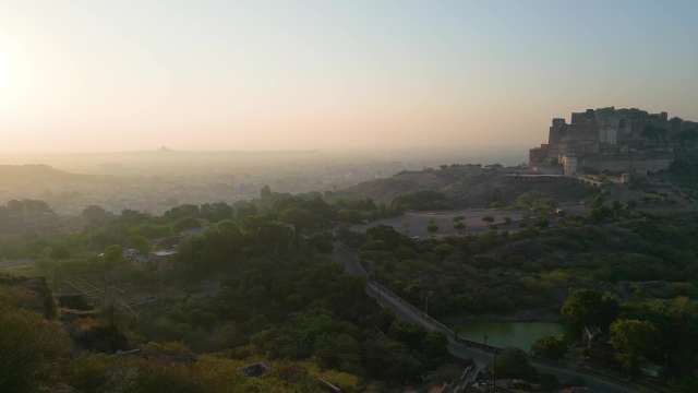 Majestic Mehrangarh Fort at Sunrise Overlooking the Misty Blue City of Jodhpur