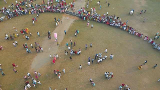 Aerial View of a Large Crowd Gathering at an Outdoor Event