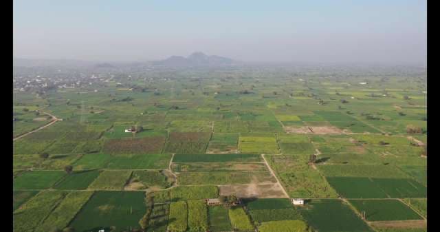 Aerial View of Lush Green Agricultural Fields and Rural Landscape