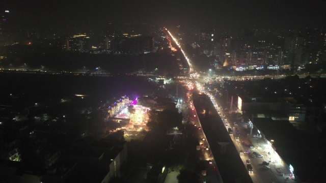 Aerial View of Night City Traffic and Urban Skyline