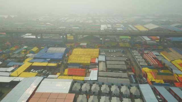 Aerial View of Foggy Tent City and Highway Flyover in India