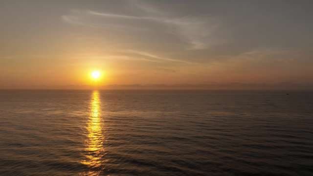 Golden Sunset Reflecting Over Calm Ocean Horizon