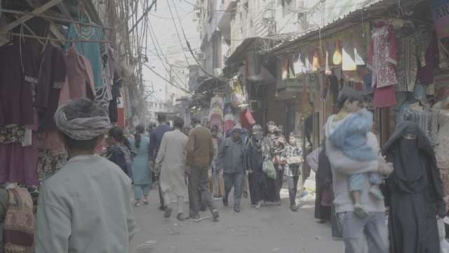 Busy Street Market in Old Delhi India with Crowded Shops