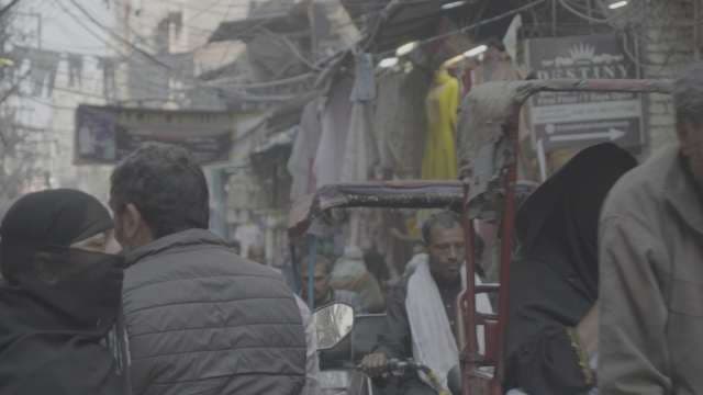 Busy Street Market and Rickshaws in Old Delhi