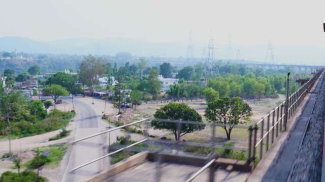 Scenic Train View of Rural Landscape and Mountains
