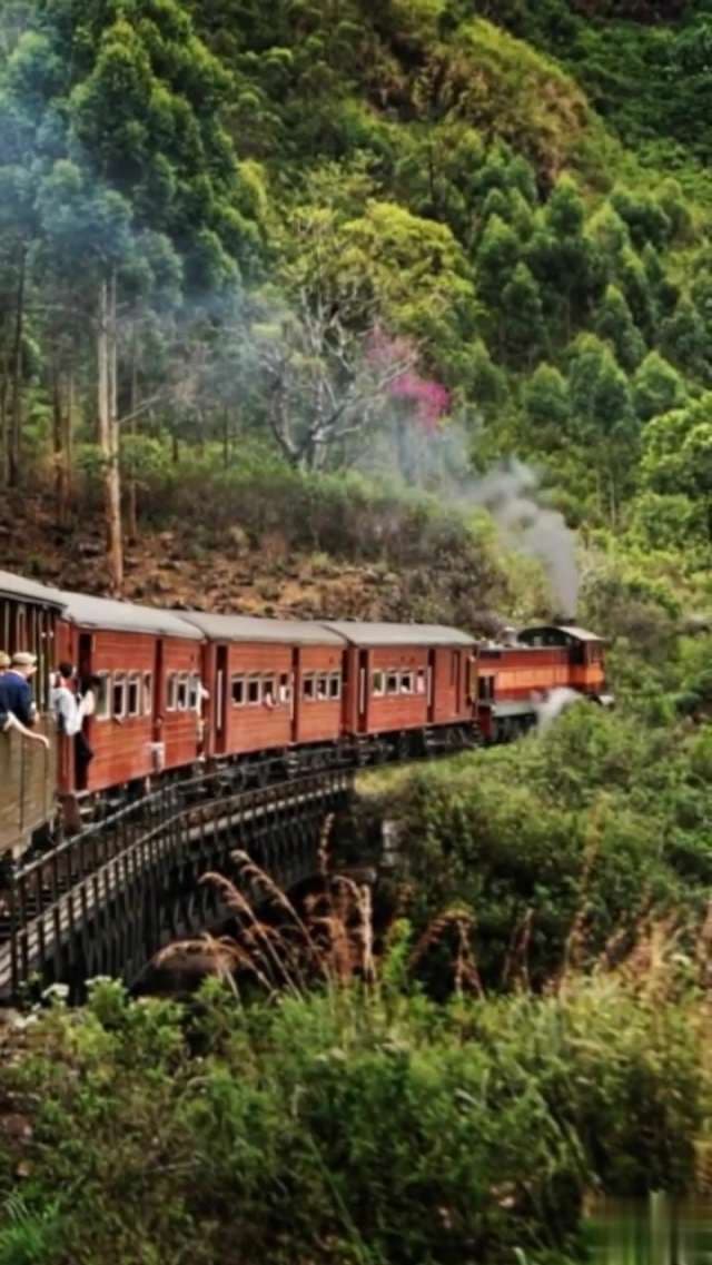 Scenic Vintage Steam Train Journey Through Lush Green Mountains