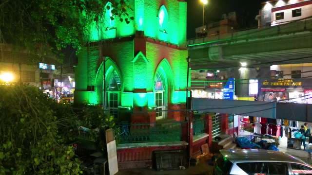 Green Illuminated Historic Clock Tower in Ludhiana Market at Night