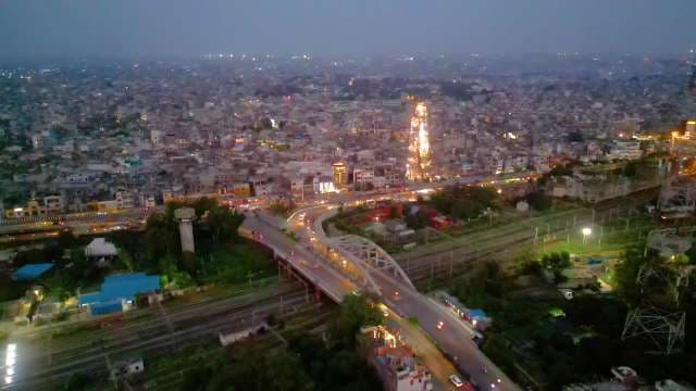 Aerial View of Urban Bridge and City Traffic at Night