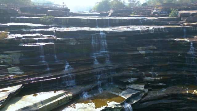 Scenic Multi-Tiered Waterfall Cascading Over Layered Rocks in Rajdari and Devdari Waterfall, Chandauli, Uttar Pradesh