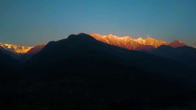 Golden Hour Sunset Over Snow-Capped Manali Mountain