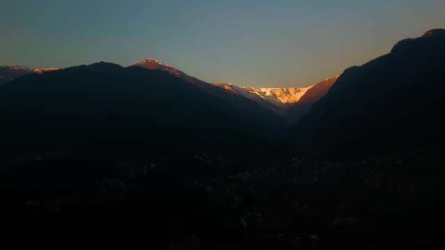 Golden Sunrise Over Snow-Capped Himalayan Mountain Peaks and Valley