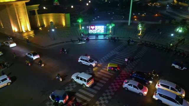 Nighttime Traffic and Illuminated Landmark in Lucknow India