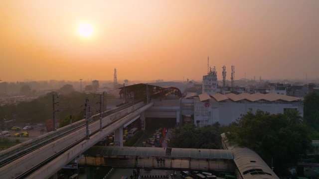 Golden Sunrise over Elevated Metro Station in Lucknow Cityscape