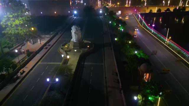 Night View of Illuminated City Streets and Statue in Lucknow India