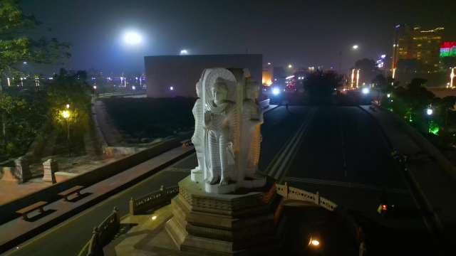 Illuminated Four-Faced Buddha Statue at Night in Lucknow